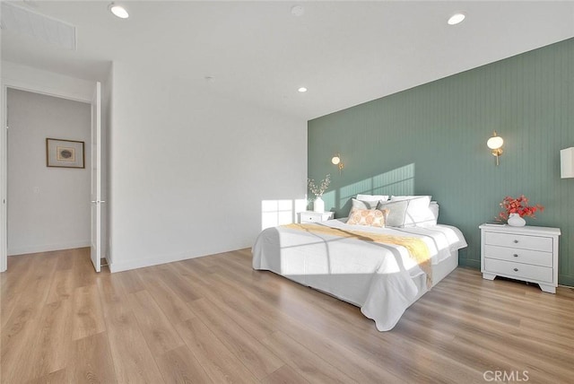 bedroom with light hardwood / wood-style floors