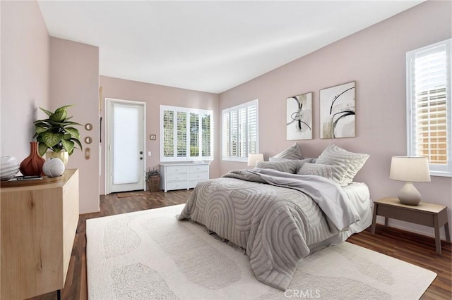 bedroom featuring dark wood-type flooring