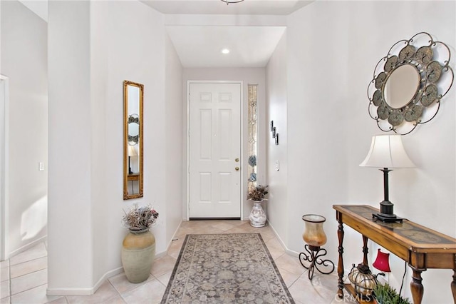 entryway with light tile patterned floors