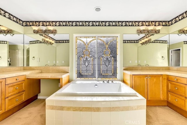 bathroom with a relaxing tiled tub and vanity