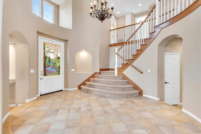 foyer with a high ceiling and a healthy amount of sunlight