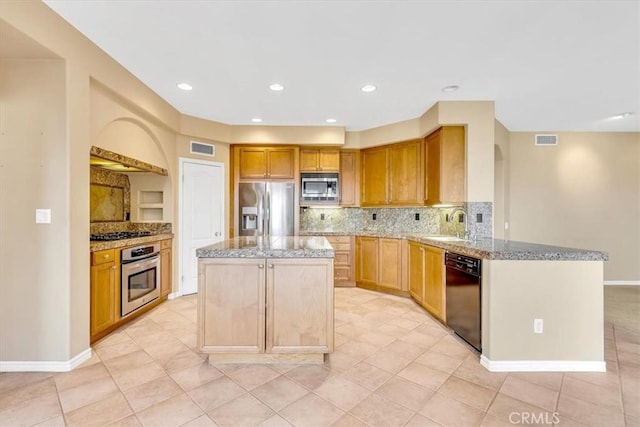 kitchen featuring tasteful backsplash, a kitchen island, kitchen peninsula, and appliances with stainless steel finishes