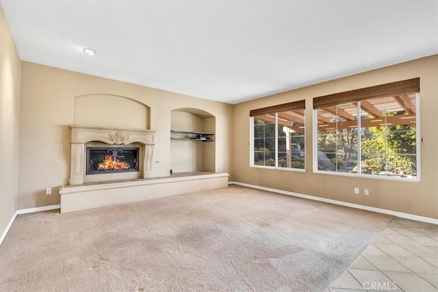 unfurnished living room with light colored carpet