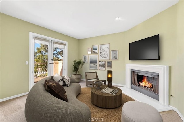 carpeted living room featuring french doors