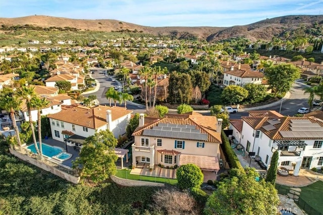 birds eye view of property featuring a mountain view