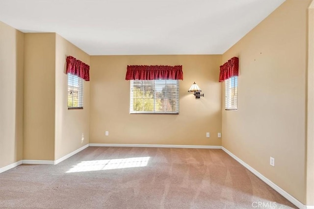 unfurnished room with carpet flooring