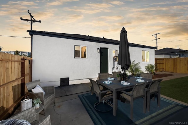 view of patio terrace at dusk