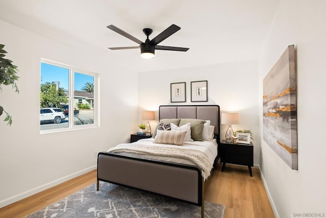 bedroom featuring hardwood / wood-style flooring and ceiling fan