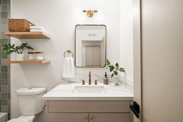 bathroom with vanity and toilet