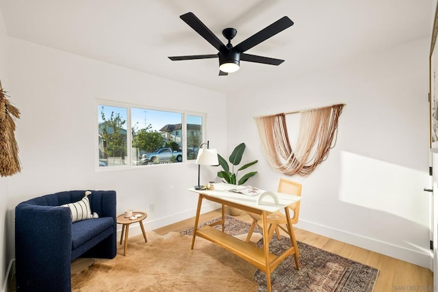 office area with ceiling fan and light hardwood / wood-style flooring