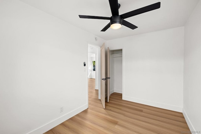 unfurnished bedroom with a closet, ceiling fan, and light hardwood / wood-style floors