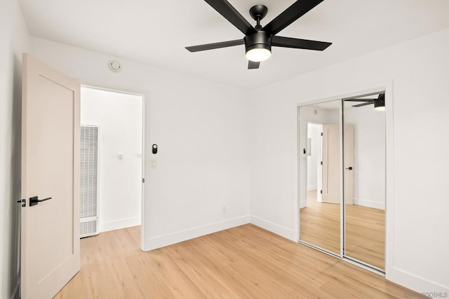 unfurnished bedroom with ceiling fan and light hardwood / wood-style flooring