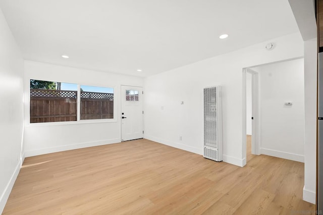 empty room with light hardwood / wood-style floors