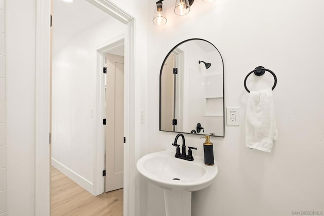 bathroom with sink and hardwood / wood-style floors