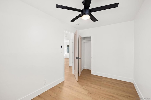 spare room with ceiling fan and light hardwood / wood-style floors