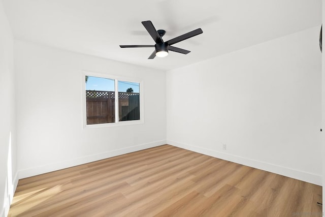 spare room featuring light hardwood / wood-style floors and ceiling fan