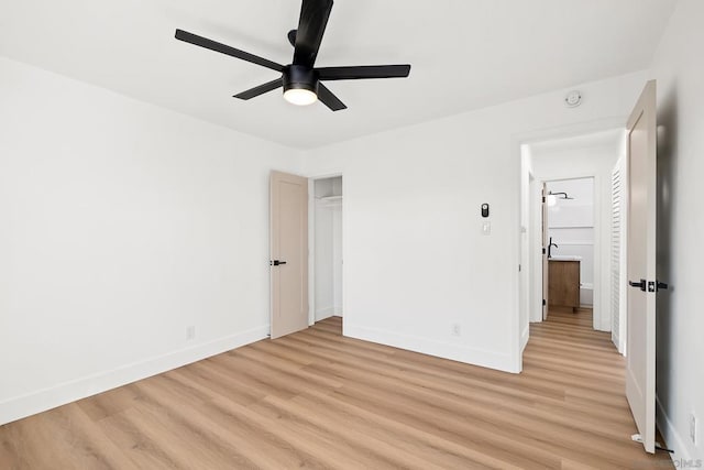 unfurnished bedroom featuring ceiling fan and light wood-type flooring