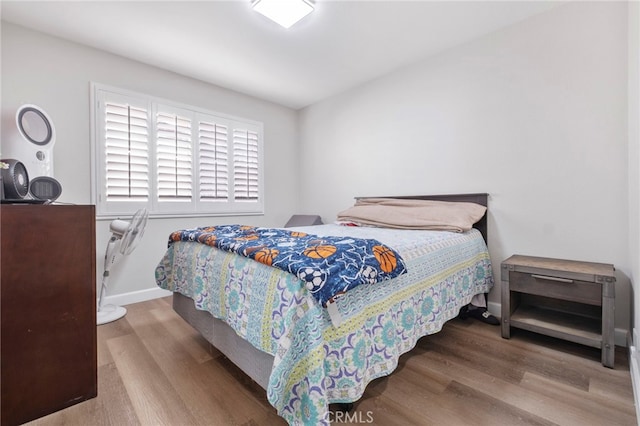 bedroom with wood-type flooring