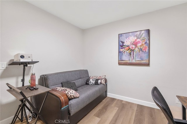 home office with light hardwood / wood-style floors