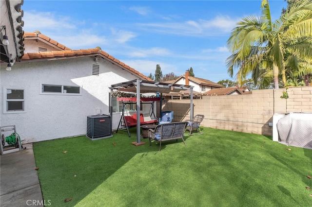 view of yard with central AC unit and a pergola