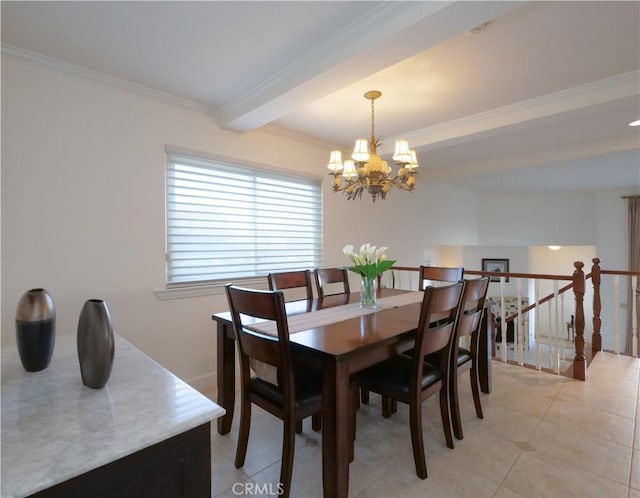 dining space with ornamental molding and a chandelier