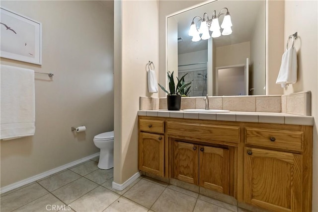 bathroom featuring tile patterned flooring, vanity, and toilet