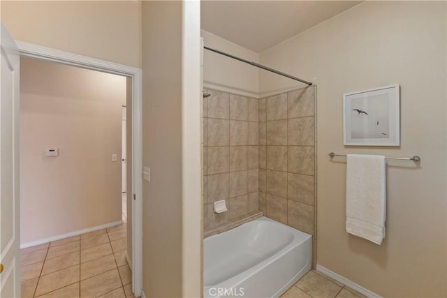 bathroom with tiled shower / bath combo and tile patterned floors