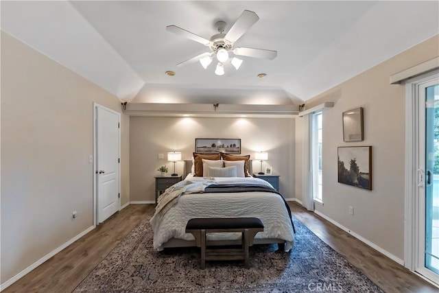 bedroom featuring hardwood / wood-style flooring, lofted ceiling, and ceiling fan