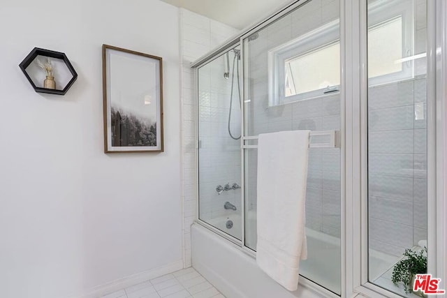 bathroom featuring enclosed tub / shower combo and tile patterned floors