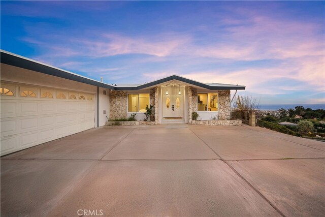 single story home featuring a garage