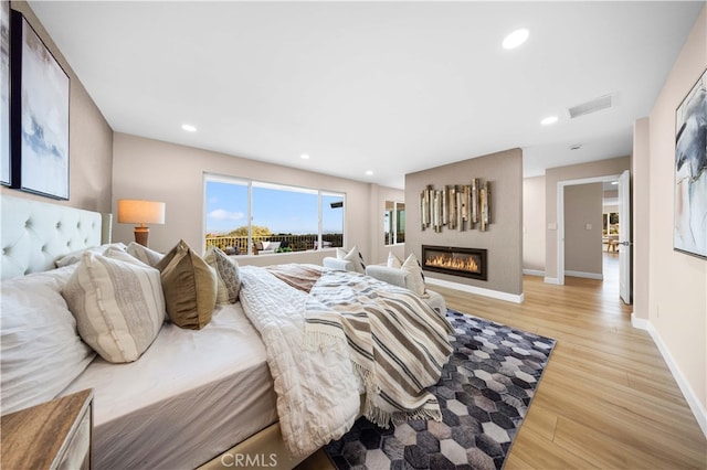 bedroom with light wood-type flooring