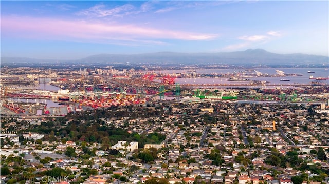 aerial view featuring a water and mountain view