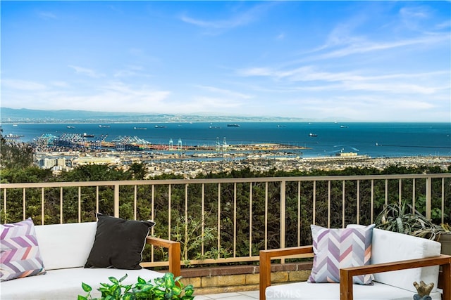 balcony with a water view and a beach view