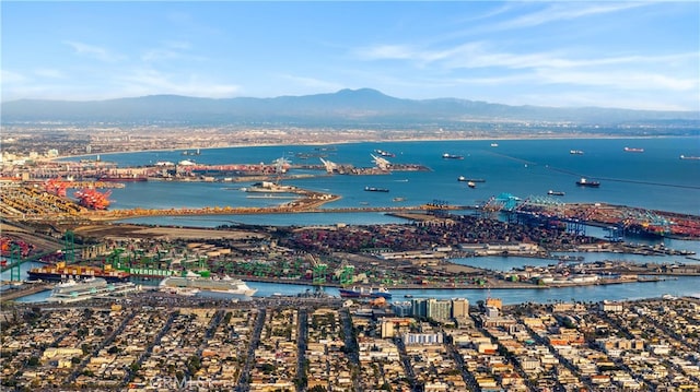 bird's eye view with a water and mountain view