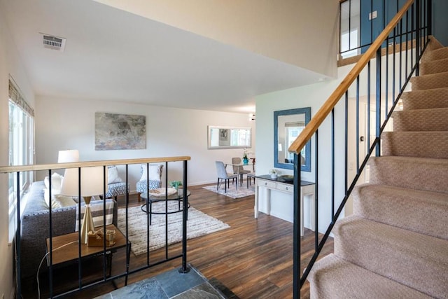 staircase featuring hardwood / wood-style floors