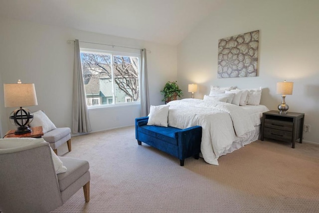 carpeted bedroom with vaulted ceiling