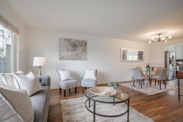 living room featuring dark hardwood / wood-style flooring and a notable chandelier