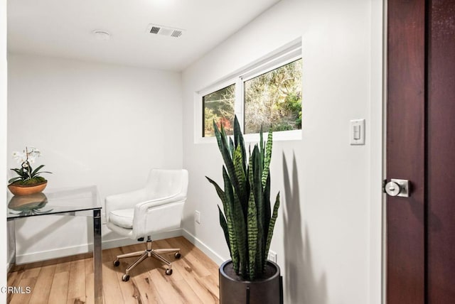 living area with wood-type flooring