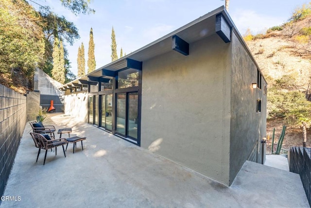 rear view of house featuring a patio area