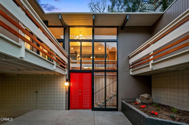 view of exterior entry at dusk