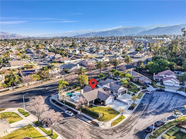 birds eye view of property with a mountain view