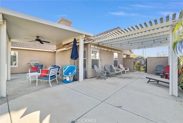 view of patio / terrace featuring ceiling fan and a pergola