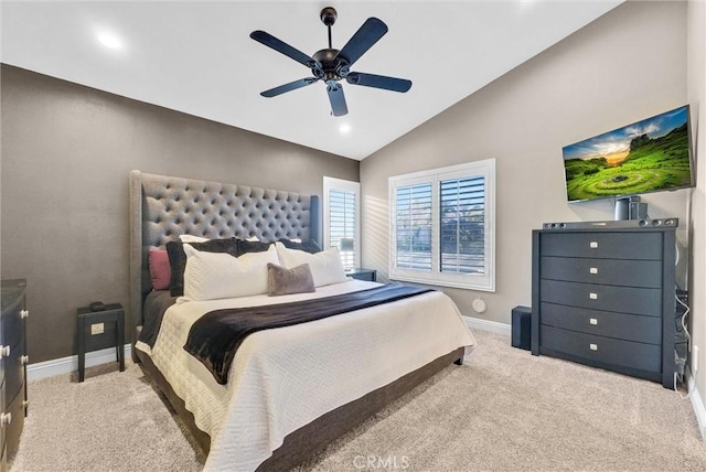 bedroom featuring ceiling fan, light colored carpet, and lofted ceiling