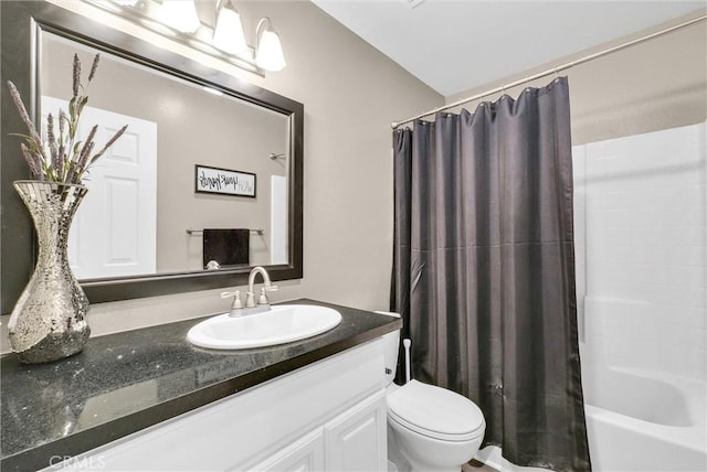 full bathroom with vanity, shower / bath combination with curtain, and toilet