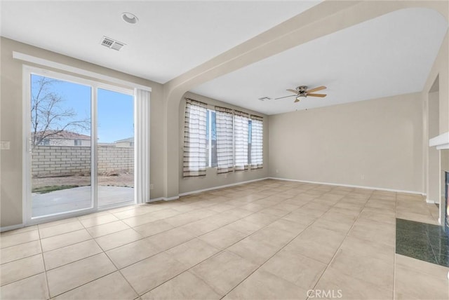 interior space with ceiling fan