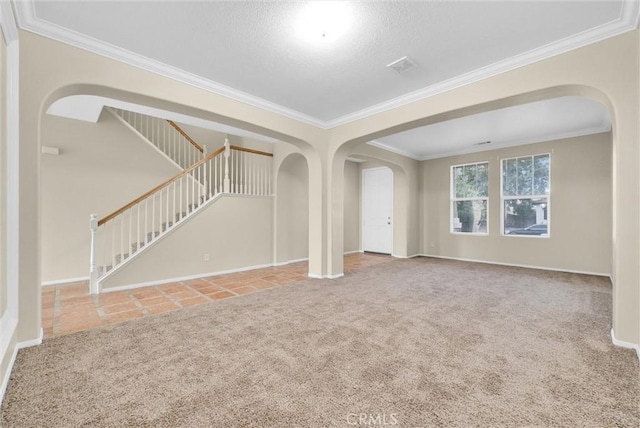 unfurnished living room with crown molding and carpet floors