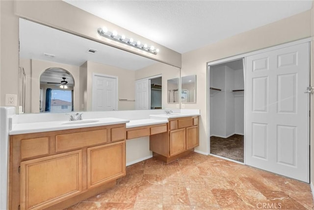 bathroom featuring vanity and ceiling fan