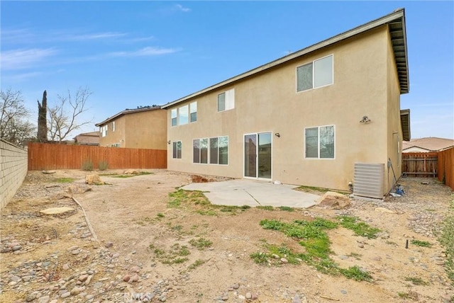 back of house with cooling unit and a patio area