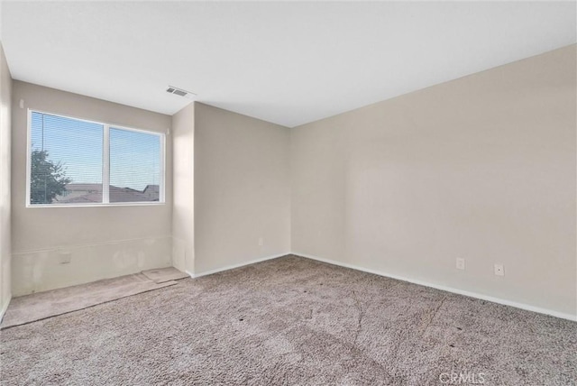 unfurnished room featuring carpet floors