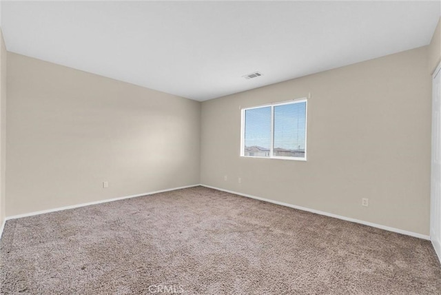 empty room featuring carpet floors